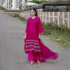 Model in a luxurious magenta muslin-silk 3-piece outfit with intricate floral embroidery, featuring a long kameez, flared palazzo pants, and a sheer dupatta from Jubaida’s Collection.
