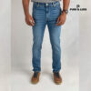 Front view on model (deep blue slim fit jeans with clean look)