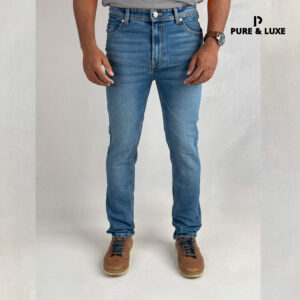 Front view on model (deep blue slim fit jeans with clean look)