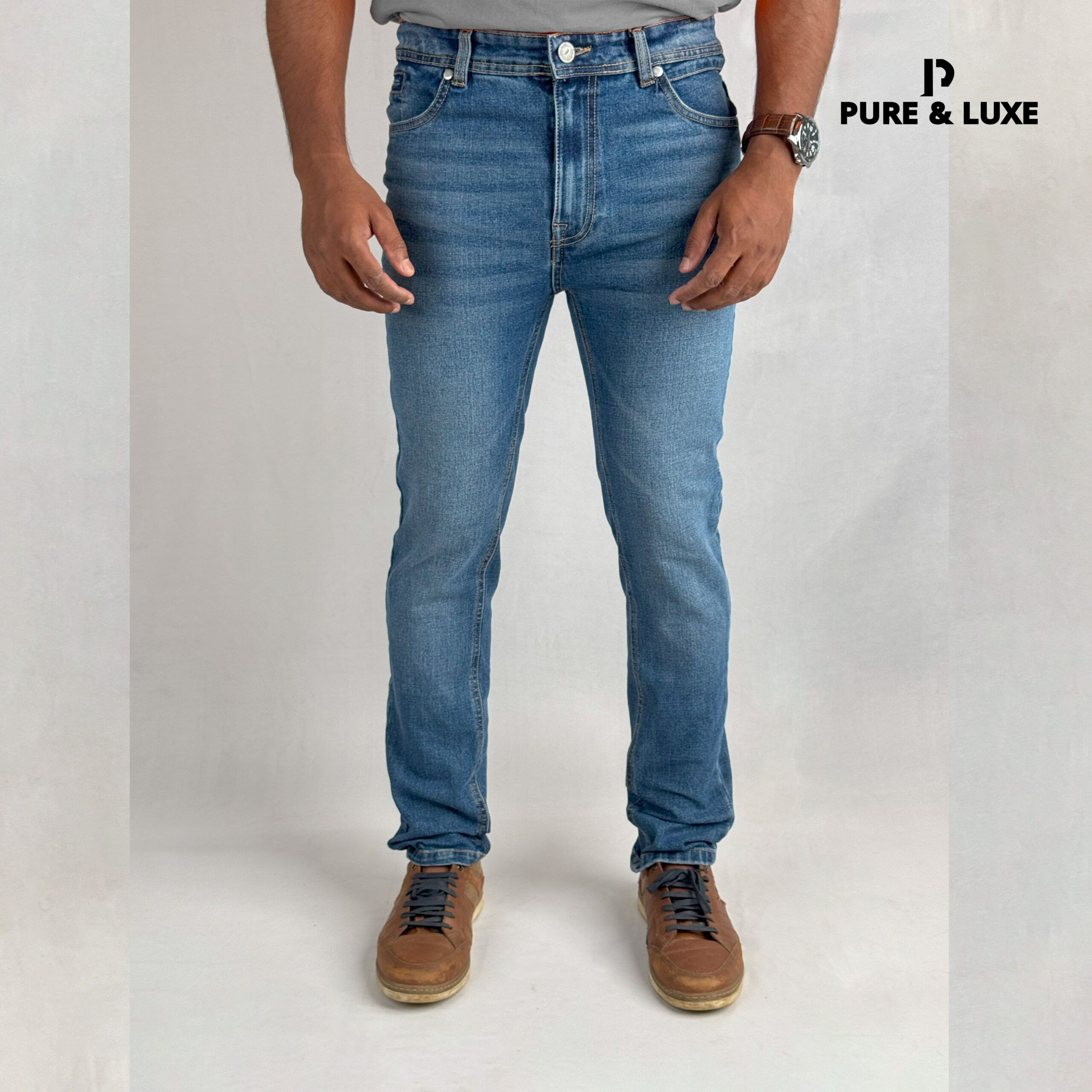 Front view on model (deep blue slim fit jeans with clean look)