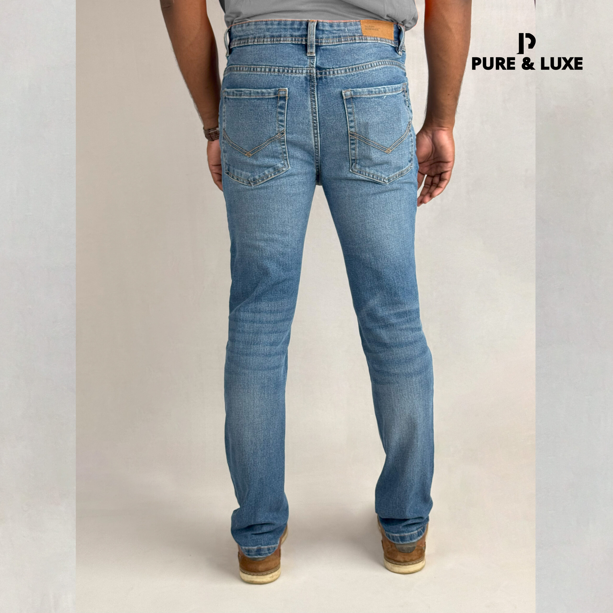 Back view of Mid Blue Slim Fit Jeans – Urban Wash Denim for Men – Pure & Luxe Street Style Look