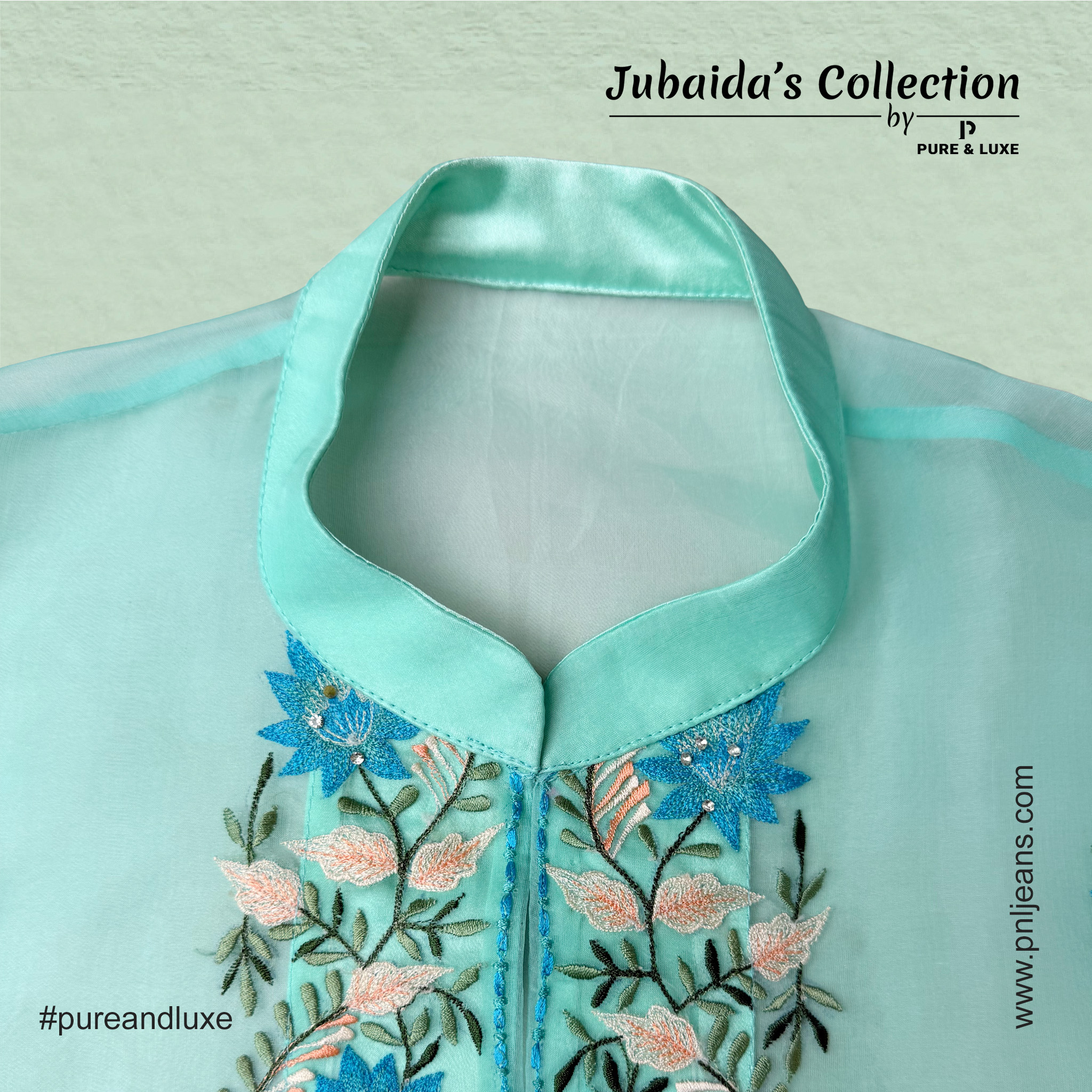 Close-up view of front neck embroidery on the muslin outer layer of the Two-Piece Kurti Set, showcasing fine threadwork on a soft, elegant fabric.