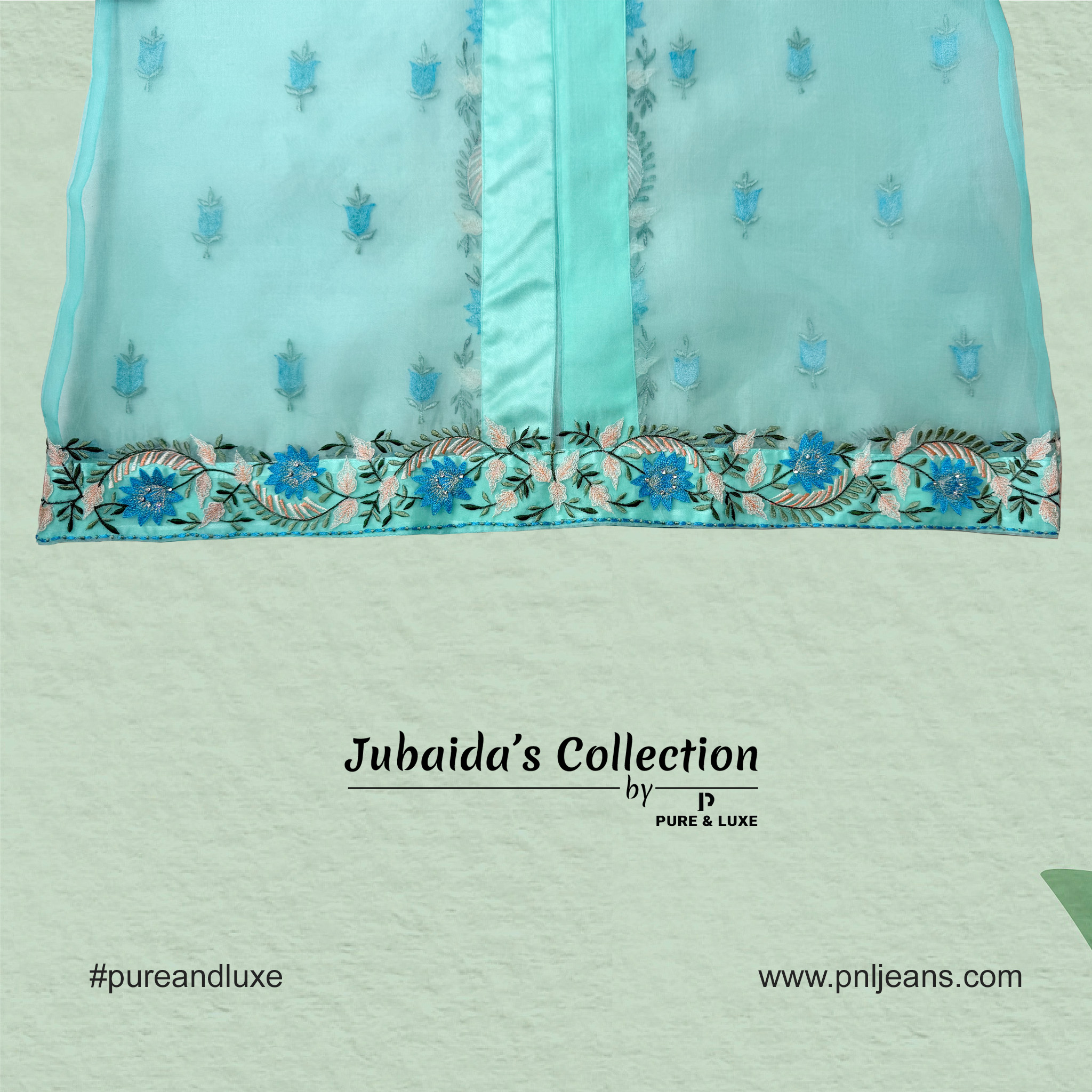 Close-up view of front bottom embroidery on the muslin outer layer of the Two-Piece Kurti Set, showcasing fine threadwork on a soft, elegant fabric.