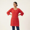 Front View of Crimson Short Kurti with Gold Geometric Motif and Notched Neckline by PURE & LUXE